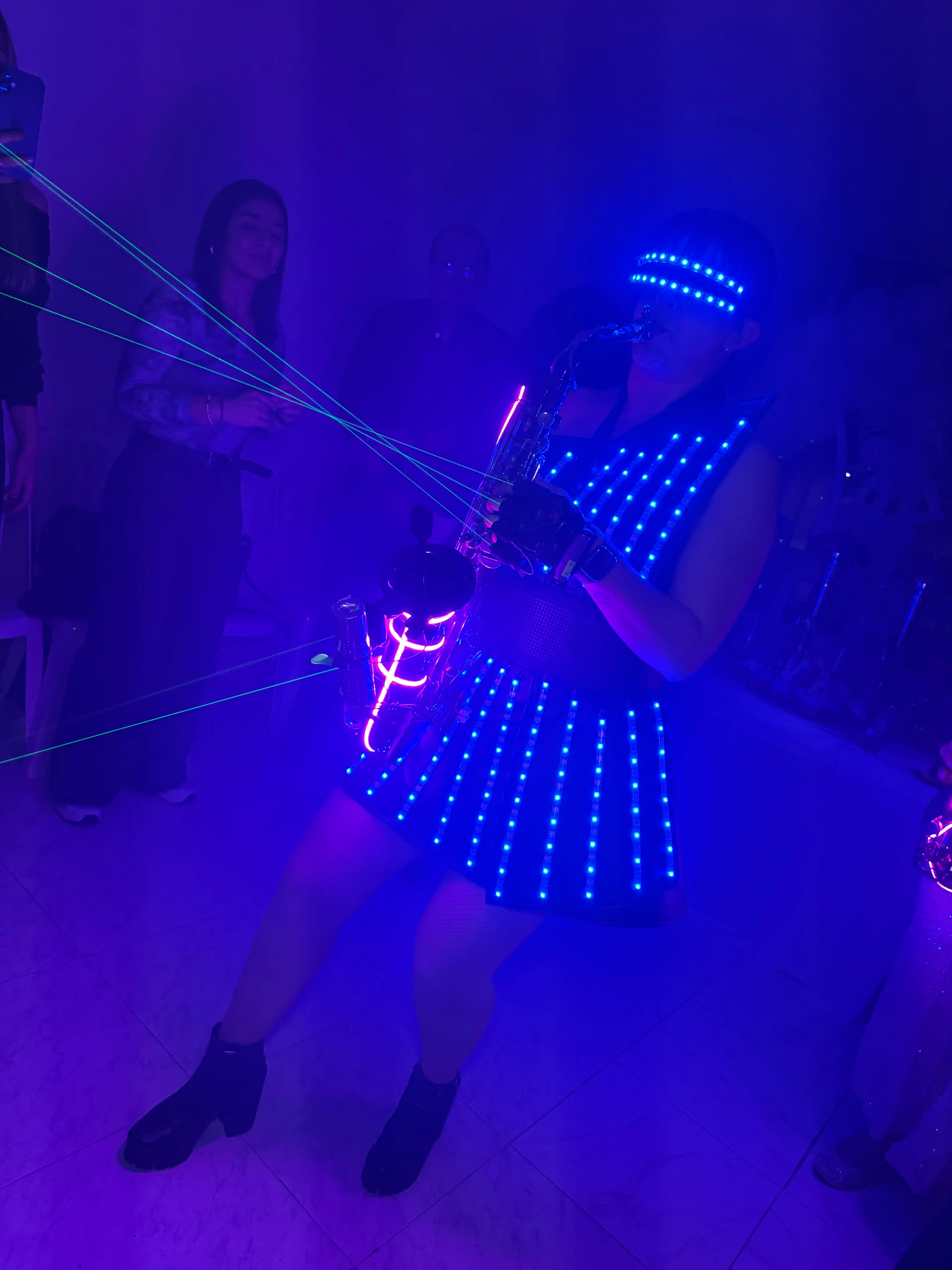 Saxophone player mid-performance during a staged party show in New York